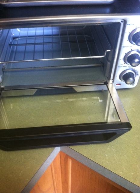 The toaster oven involved in the incident. Notice the unprotected heating element.